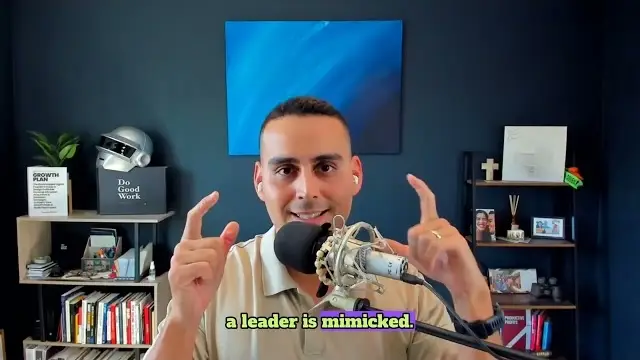 A screenshot of Raul doing his podcast with "a leader is mimicked" written in front of him